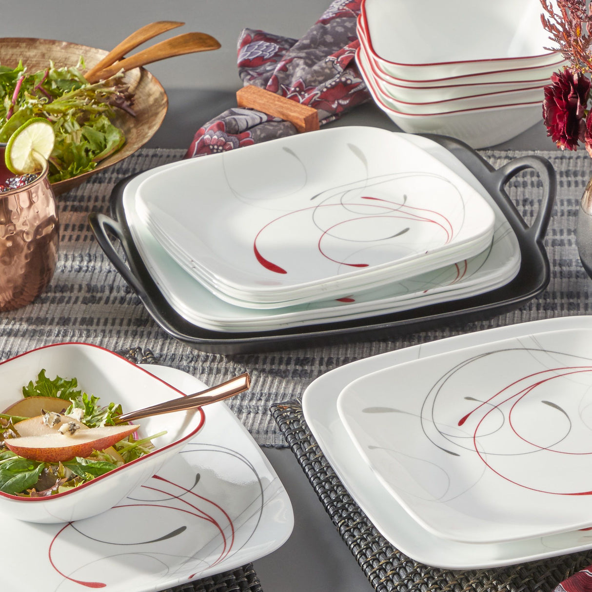 Splendor Square 18pc Dinnerware Set on the table with salad in the background