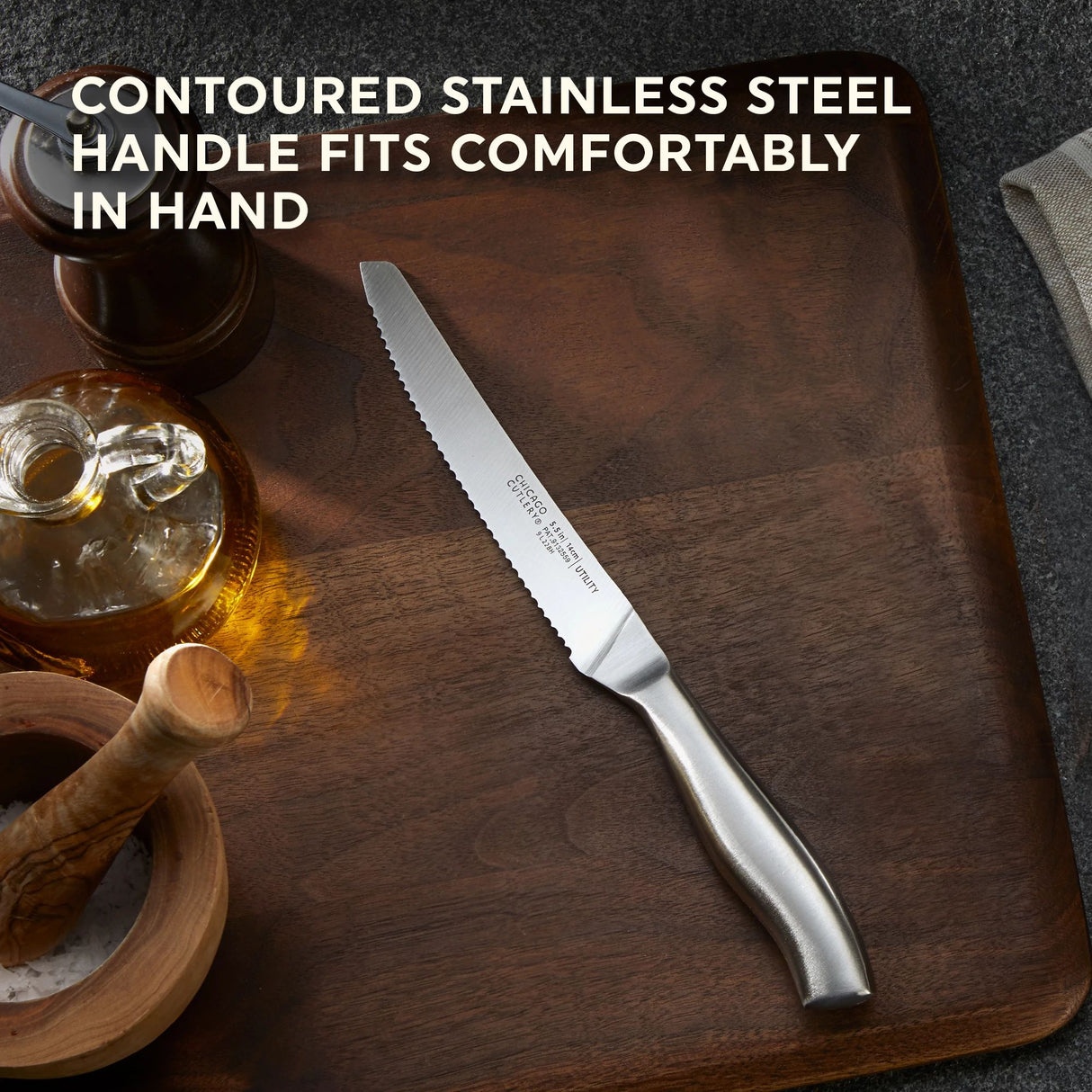 Insignia Steel Utility Knife with text contoured stainless steel handle fits comfortably in hand