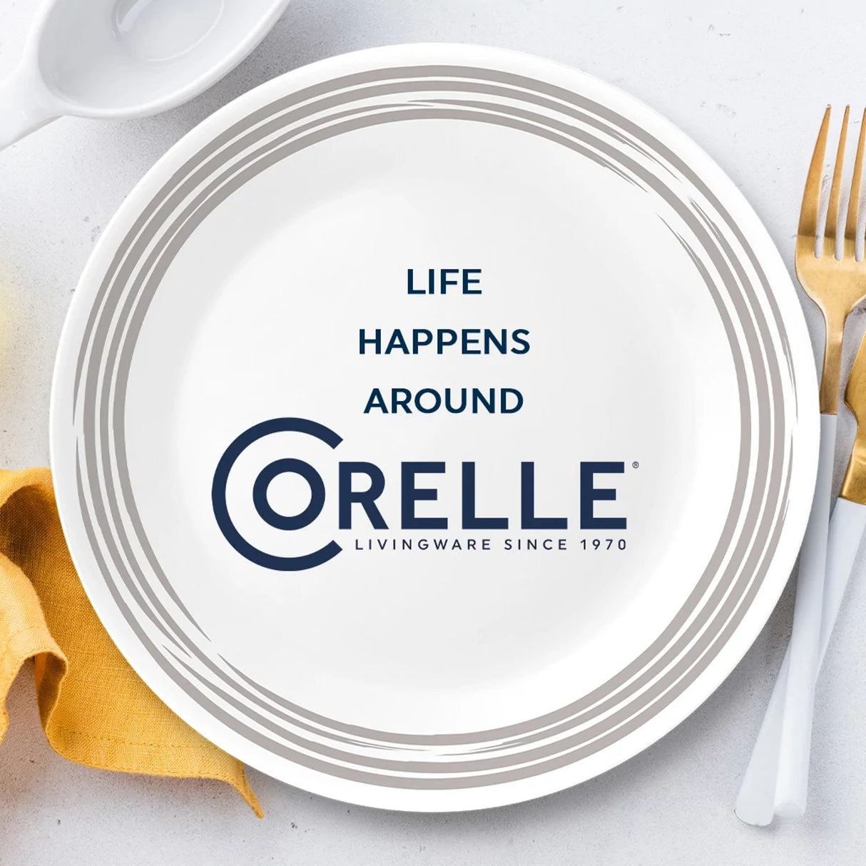 Brushed Dinnerplate with text life happens around Corelle