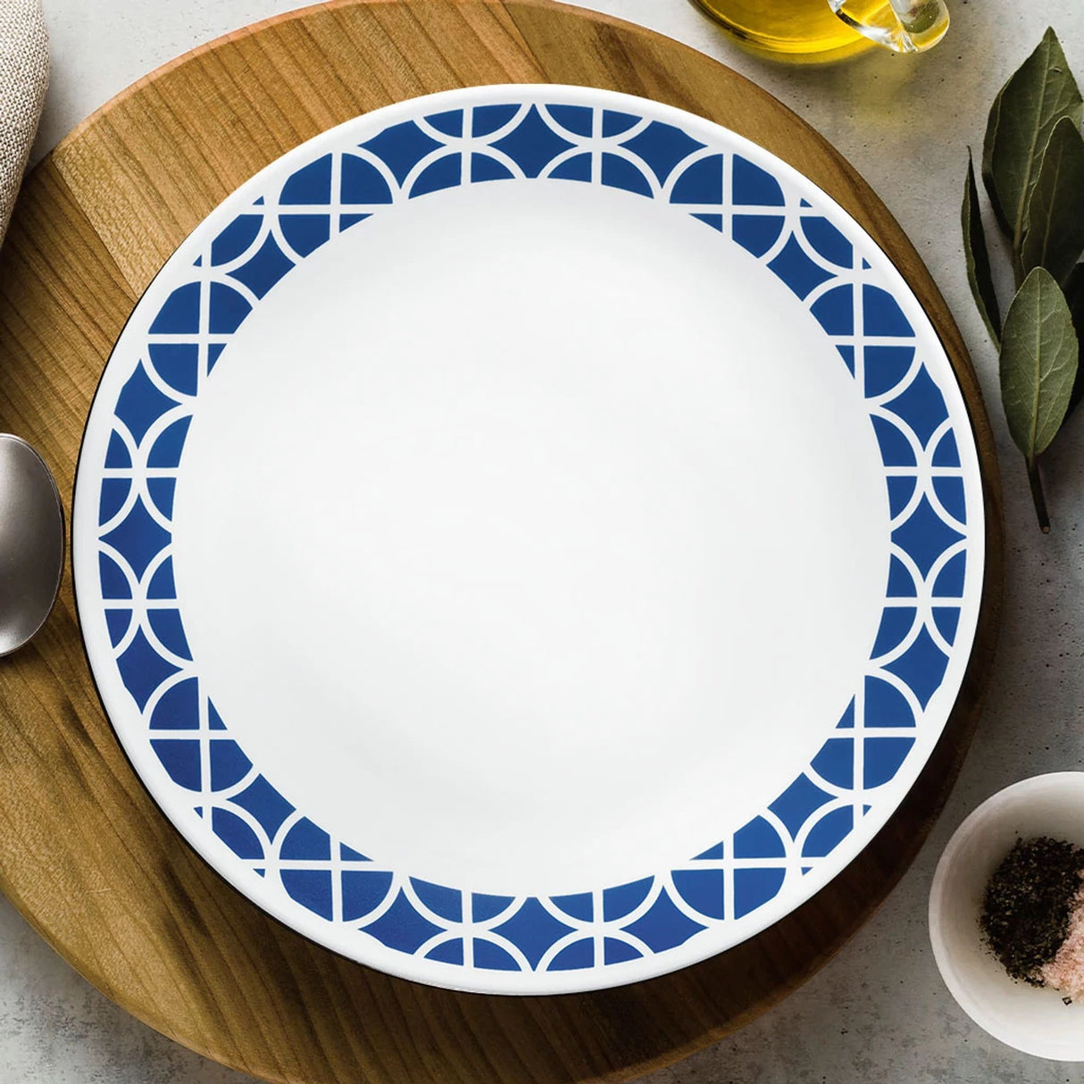 cobalt circles dinnerplate with text life happens around Corelle