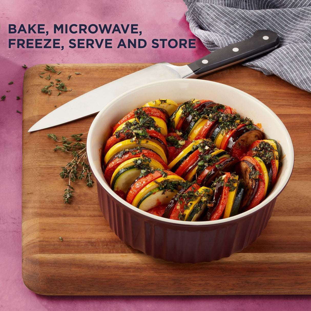 French Colors 1.5-quart Round Baking Dish, Cabernet with food inside and text on photo bake, microwave, freeze, serve & store