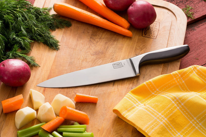  Knife on cutting board with vegetables
