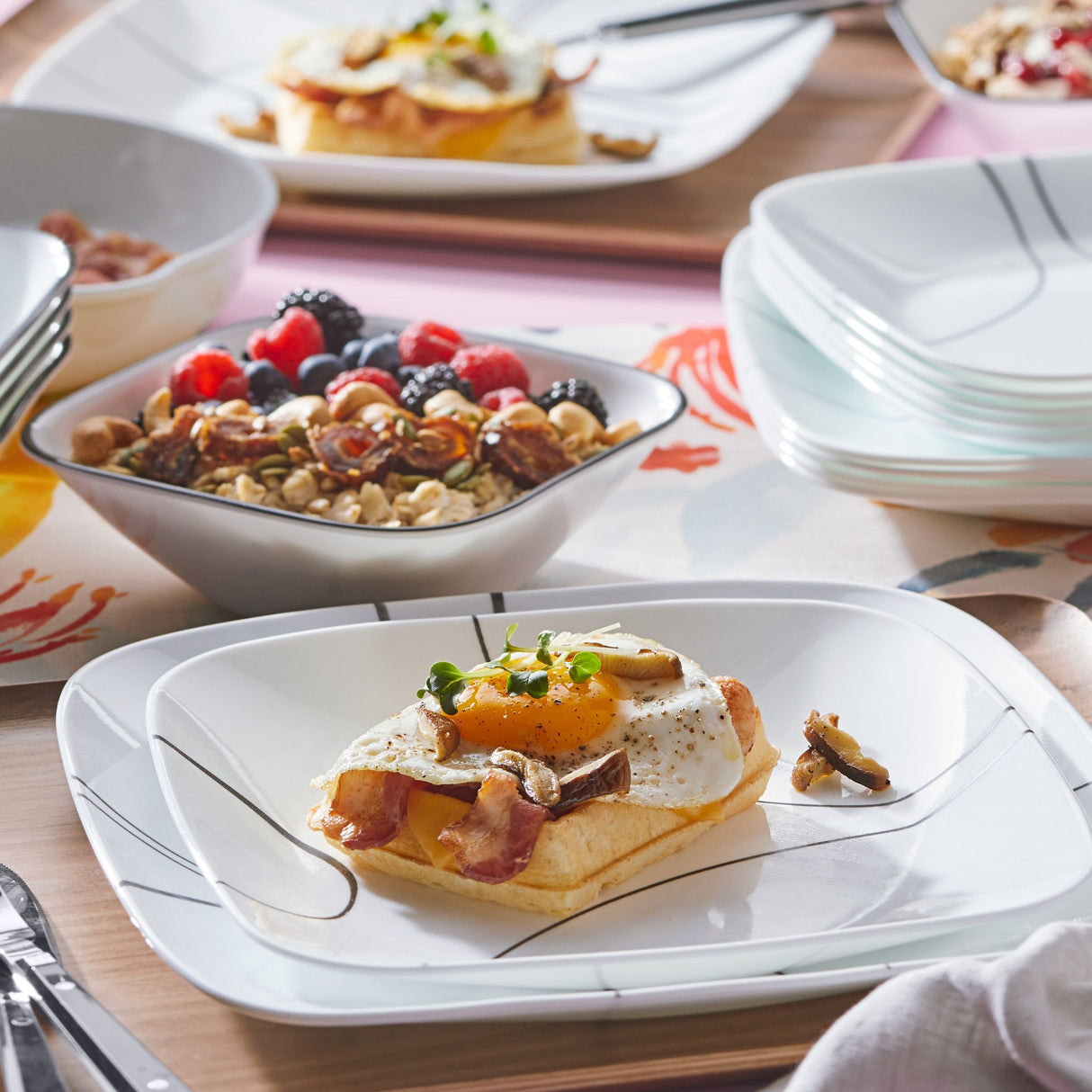 Simple Lines dinner, salad & cereal bowls on table with food