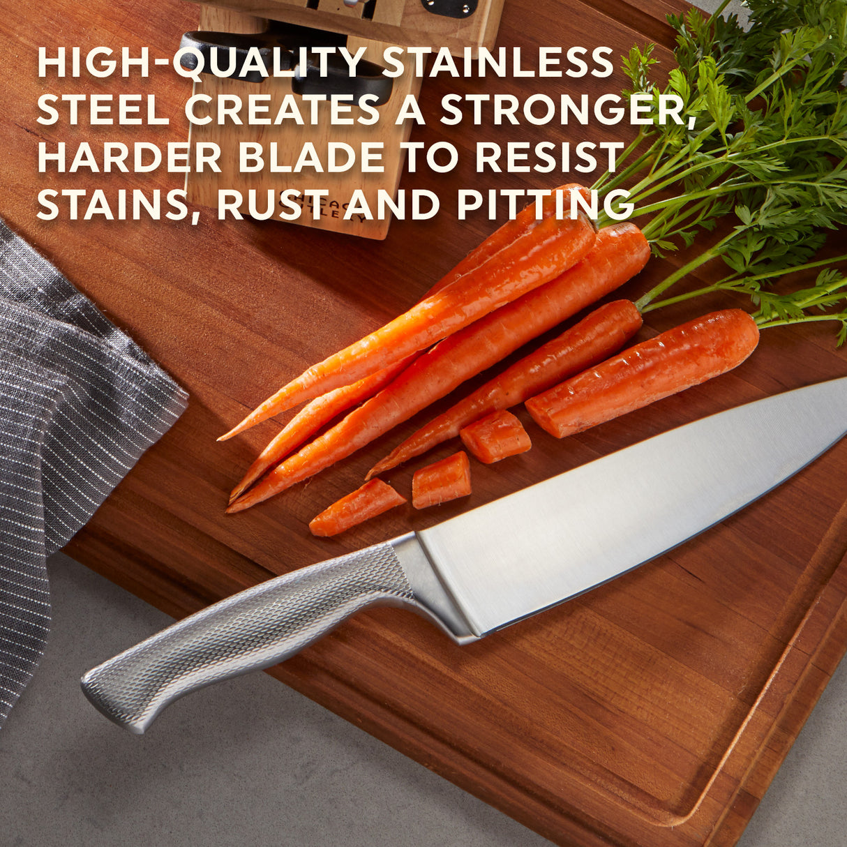 Chicago Cutlery Lasalle Chef Knife on table with carrots with text high-quality stainless steel creates a stronger harder blade to resist stains, rust & ptting