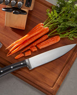 Damen Chef Knife on Cutting Board with carrots