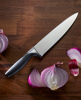 Avondale Chef knife on counter with onion beside it