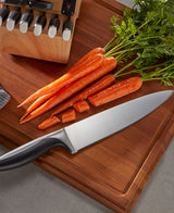 Avondale chef knife on cutting board with carrots