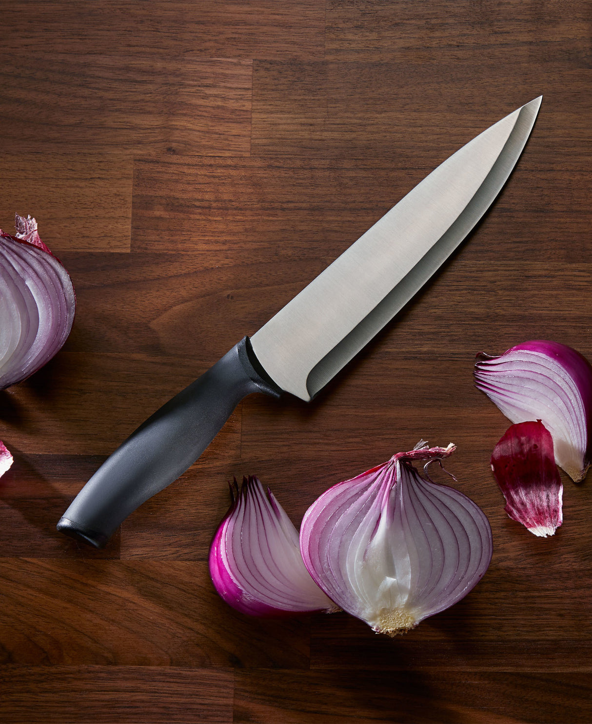 Chicago Cutlery Belmont Chef Knife on board with onion