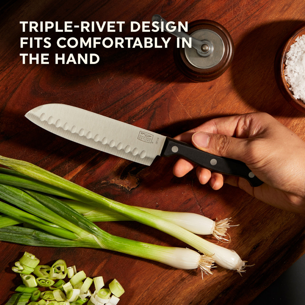 Essentials Santoku knife with text triple-rivet design fits comfortably in the hand