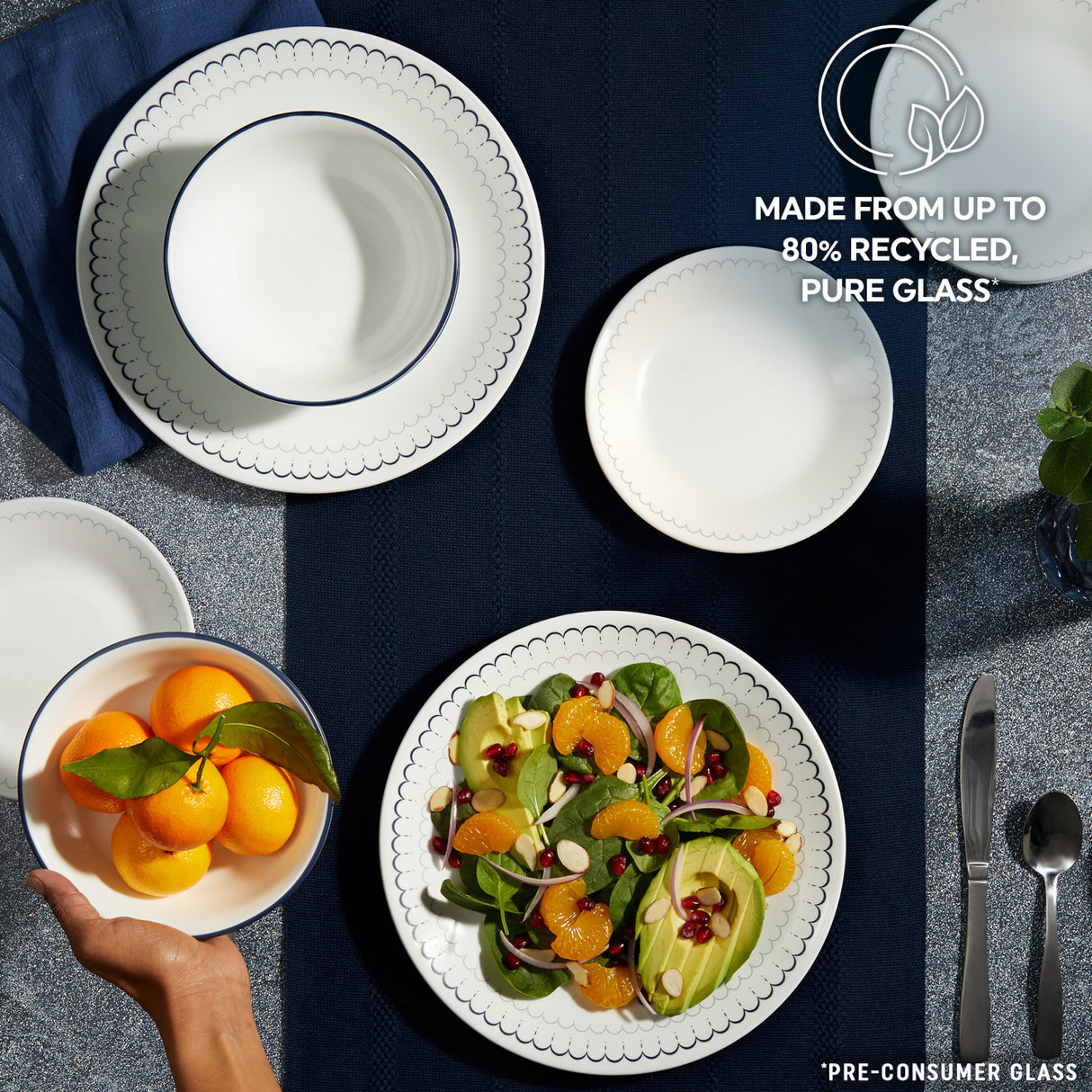Caspian Lace dinnerware on table with text made from up to 80% recycled pure glass