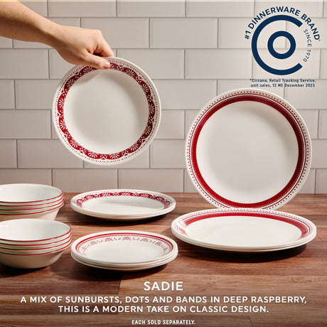 text Corelle #1 Dinnerware brand since 1970, Sadie a mix of sunbursts, dots & bands in deep raspberry. This is a modern take on classic design.