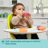 Baby drinking out of Little pouch with text soft, squeezable & easy to hold for little hands