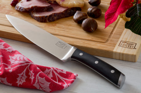 Chicago Cutlery® Damen™ 8” Chef Knife on  cutting board 