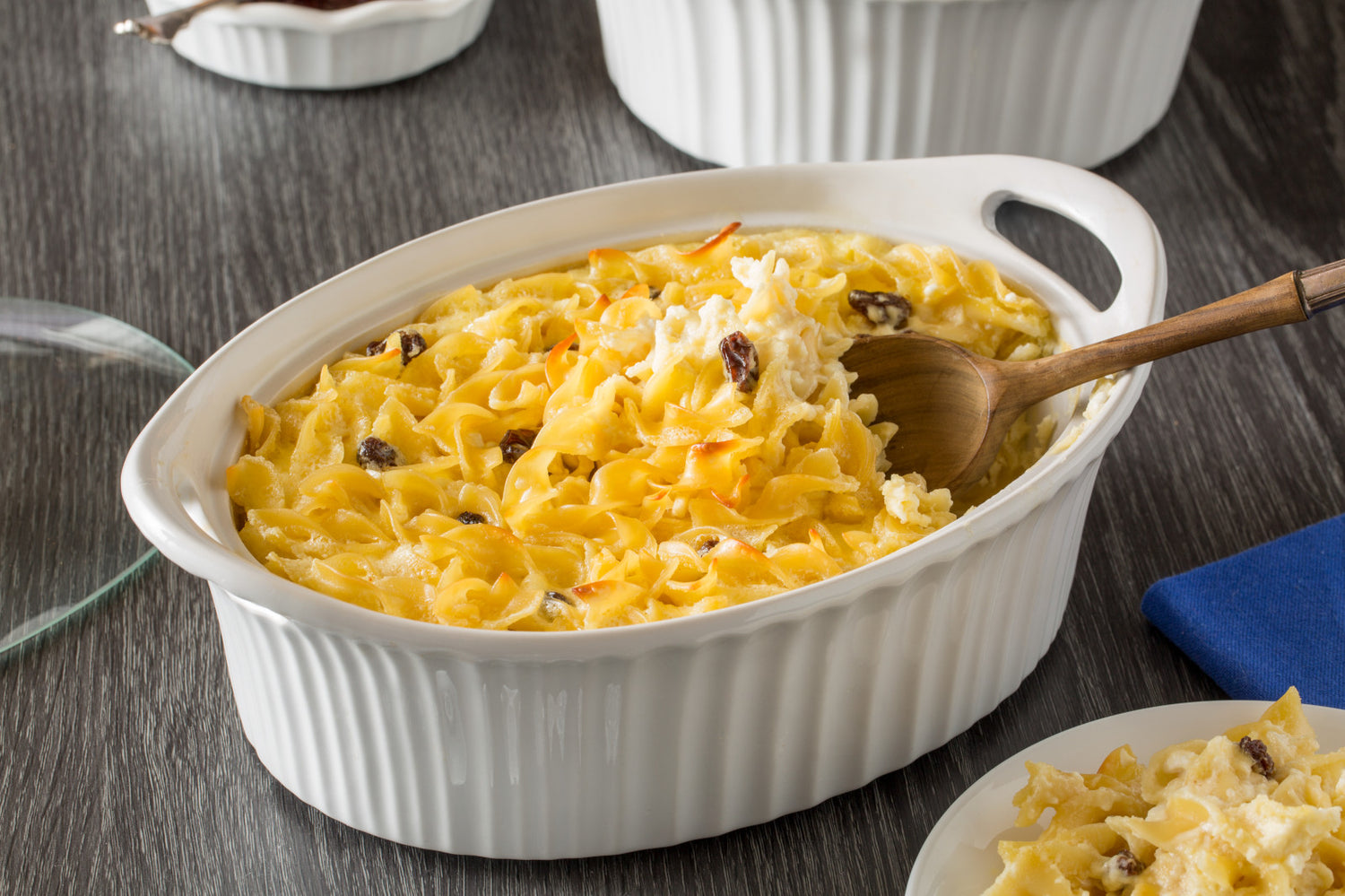 Corningware French White 1.5-qt Oval  (with lid) on table  with casserole inside