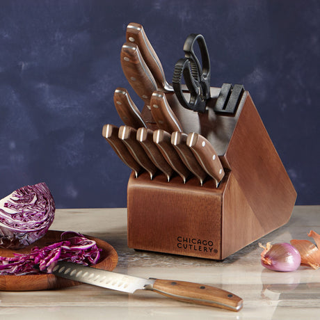  Signature Edge Walnut 13-piece Knife Block Set shown with an onion on a cutting board