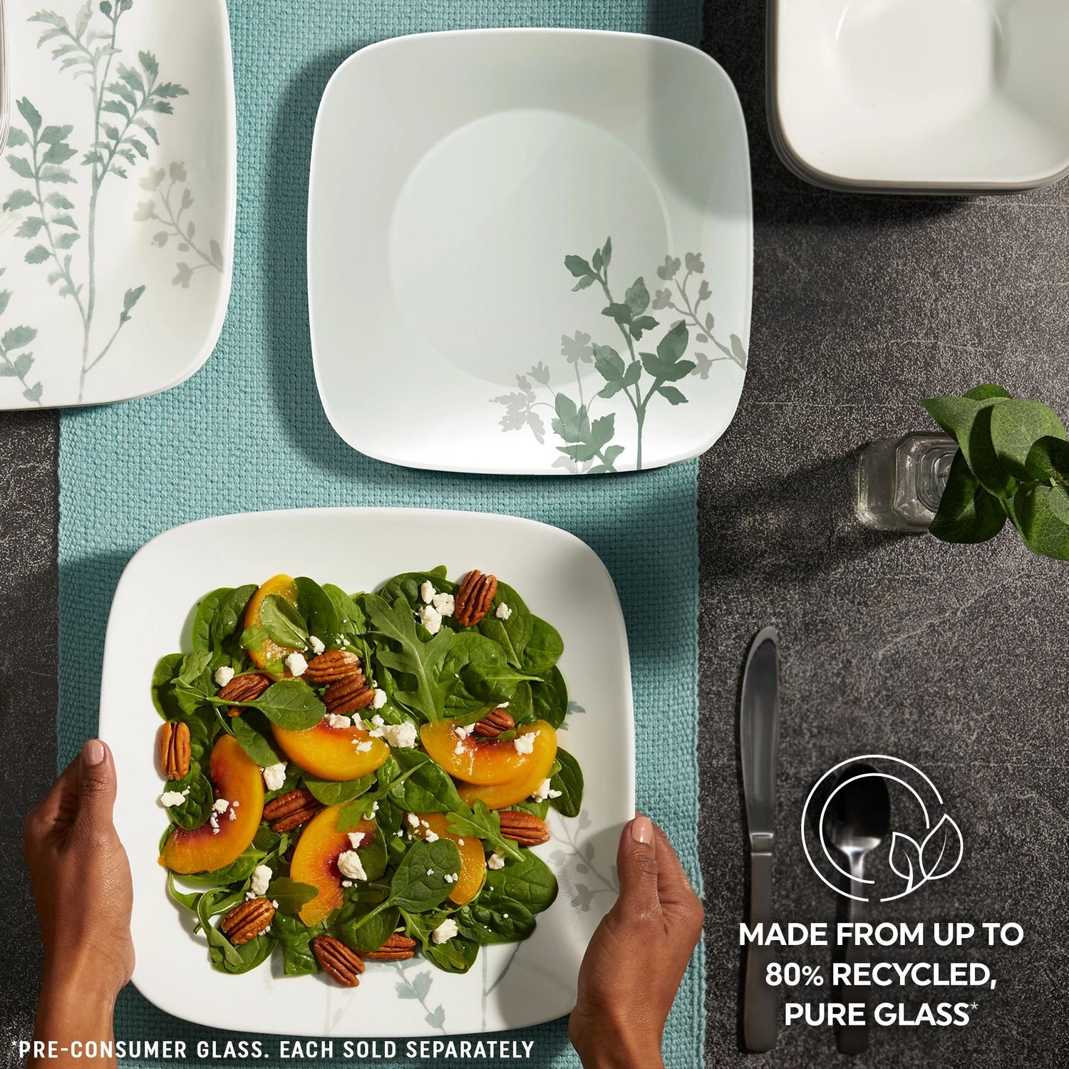  Square Amalie dinnerware on table with text made from up to 80% recycled pure glass